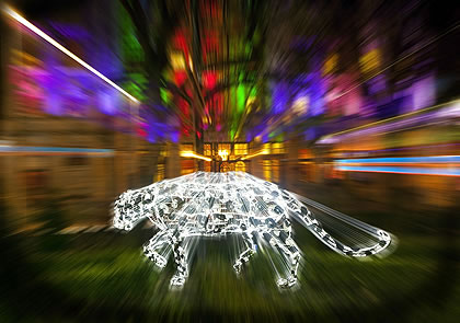 leopard sculpture lit up at night